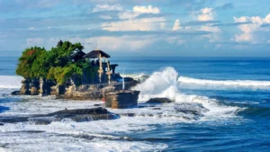 Tanah Lot sea temple at sunset, a popular tourist destination in Bali, Indonesia