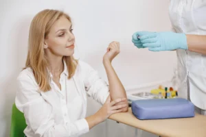 Nurse giving a woman an annual health check FBC test